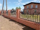 Wyrób kuty: Kute Ogrodzenie Secesyjne z Elementami Florystycznymi